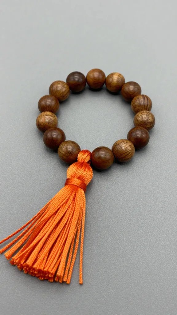 autumn stained walnut bead ring with burnt orange tassel