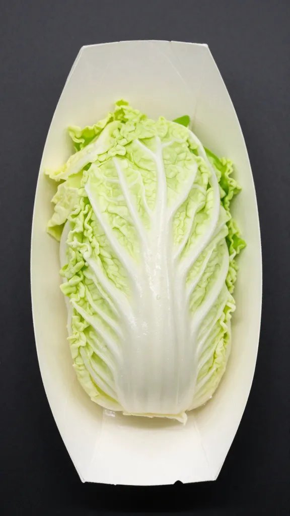 single serving of crisp-tender cabbage in waxed paper boat