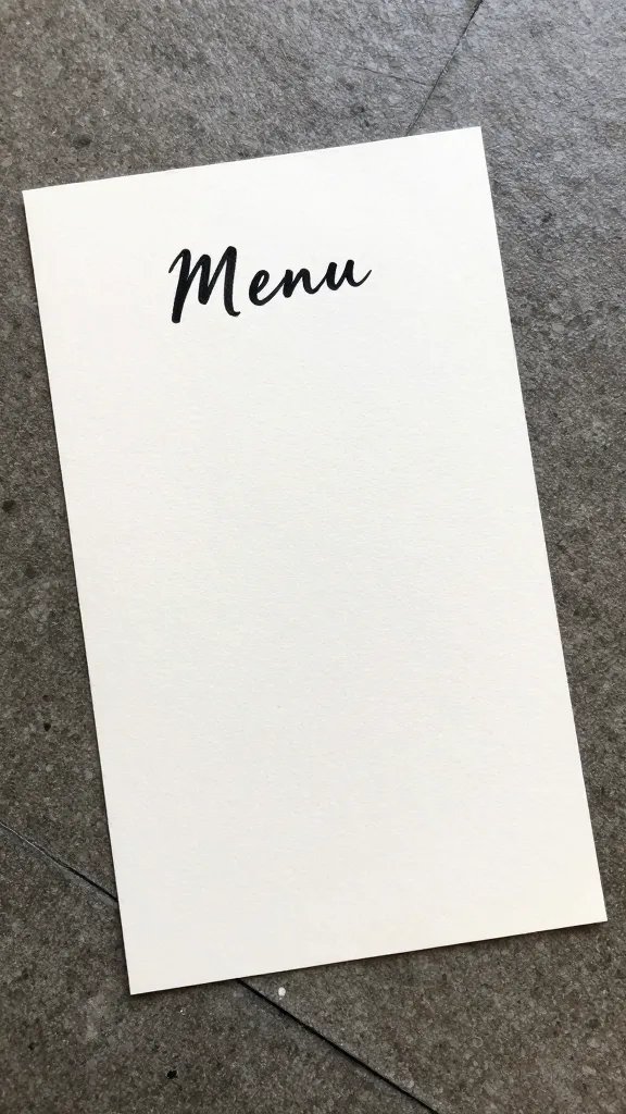 parchment menu card with handwritten script on floor