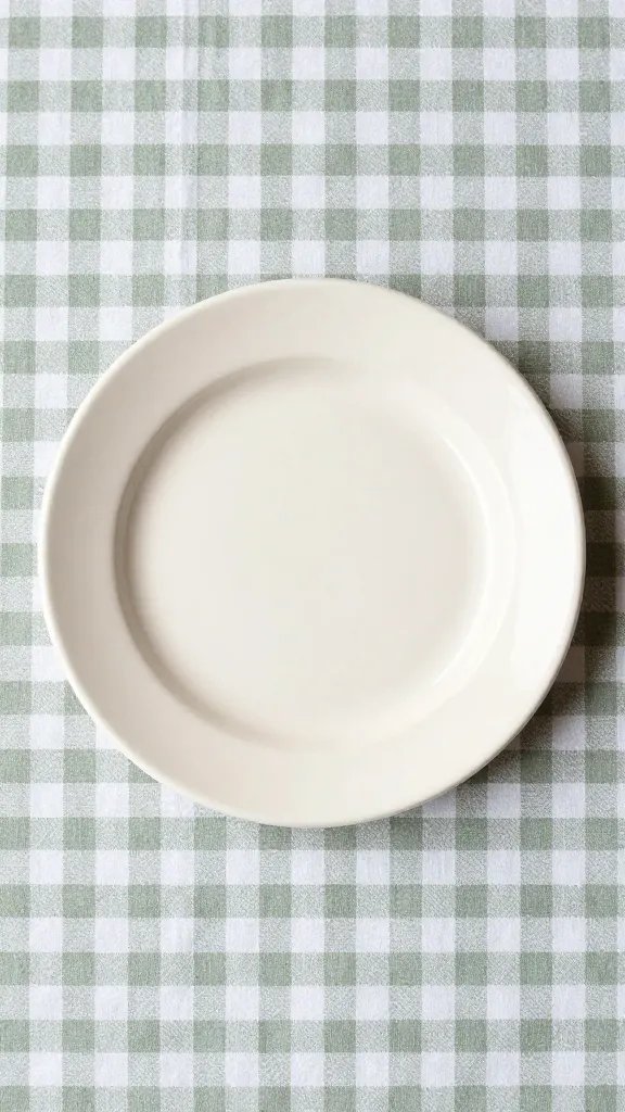 single cream enamel plate on sage gingham cloth