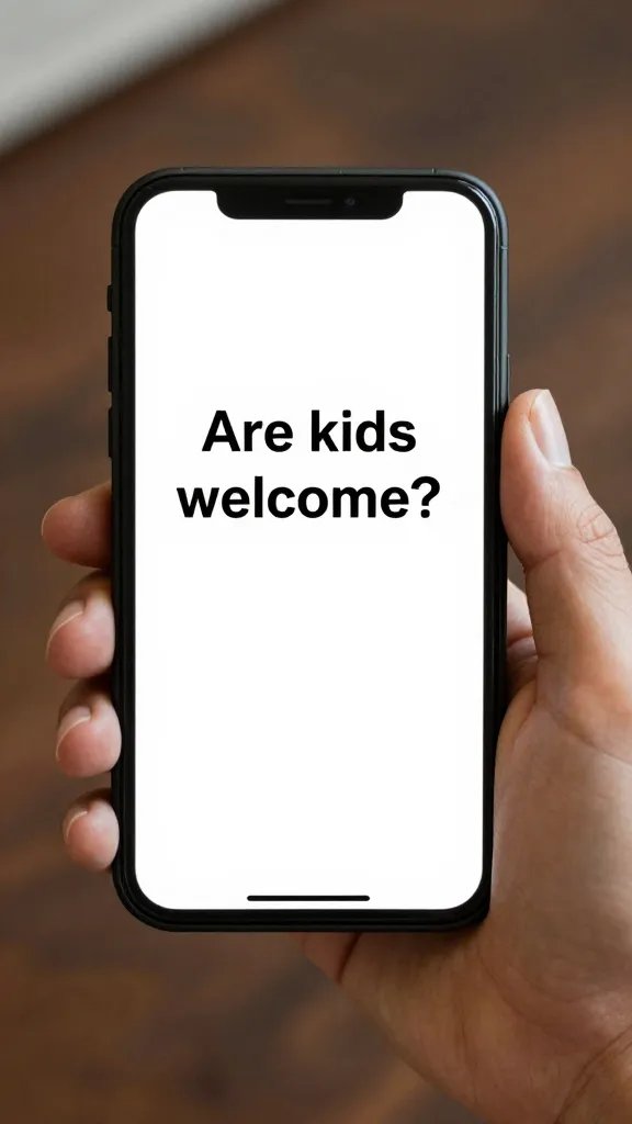 Parent’s hand typing “Are kids welcome?” on phone screen