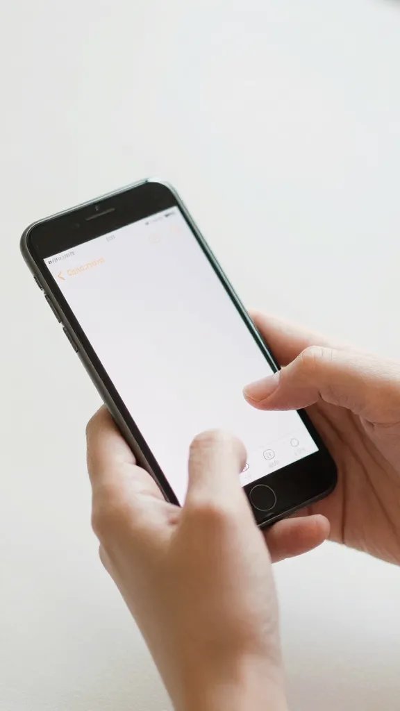 typing hands on phone composing brief decline, close crop