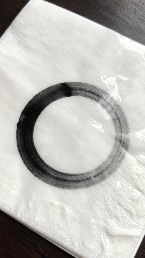 glossy photo paper napkin ring showing ink smudge closeup