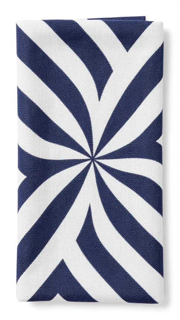closeup navy-and-white pinwheel-fold linen napkin