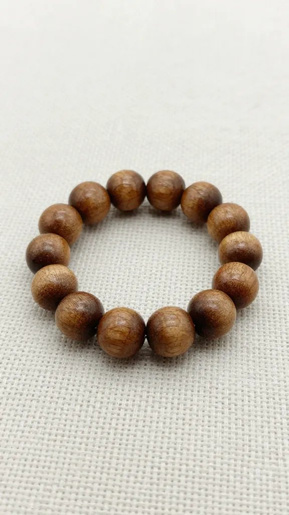 closeup of unfinished 20mm wood bead ring on linen