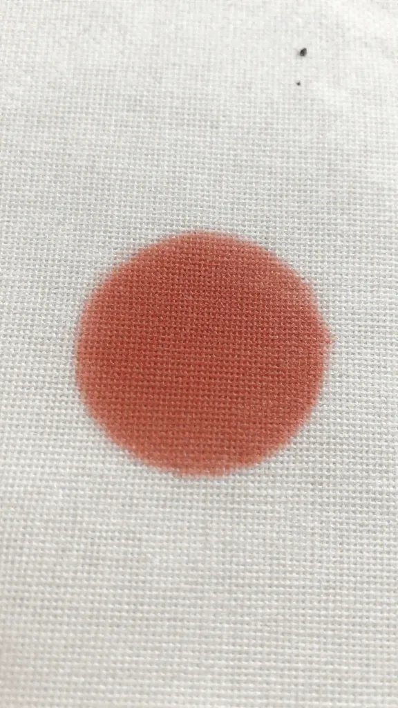 oxalic stain spot on linen before treatment, extreme closeup