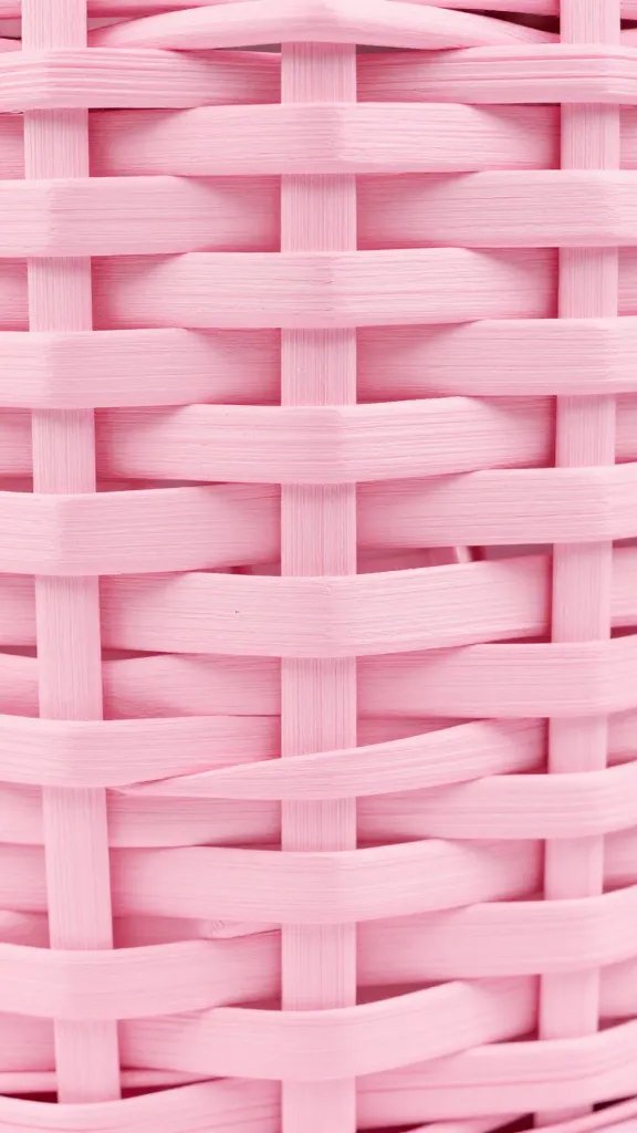 Closeup of pastel pink wood grain on basket frame
