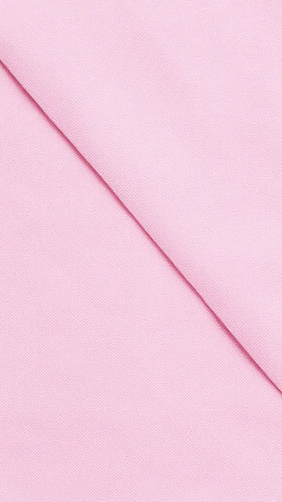 Closeup of pastel pink picnic blanket corner texture