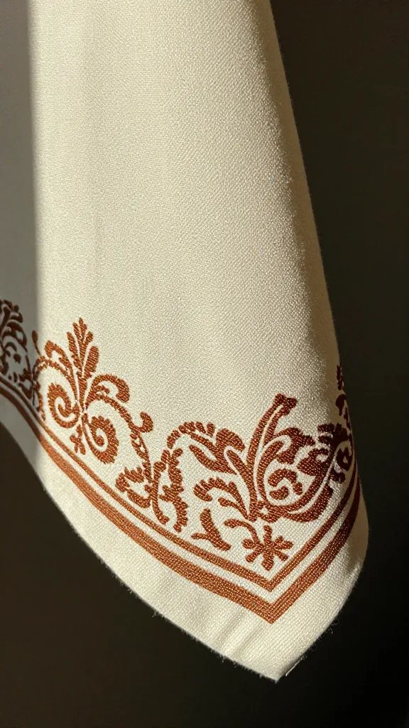 closeup of single patterned napkin corner in sunlight