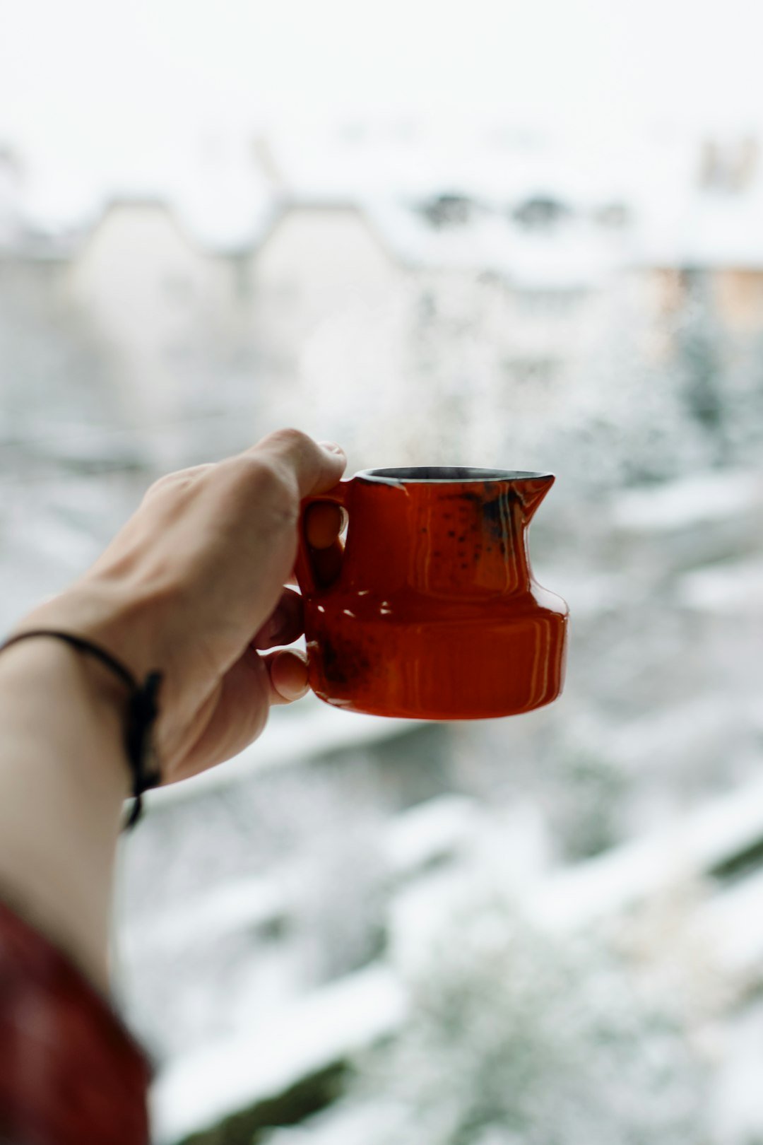 A mug of hot chocolate in the snow